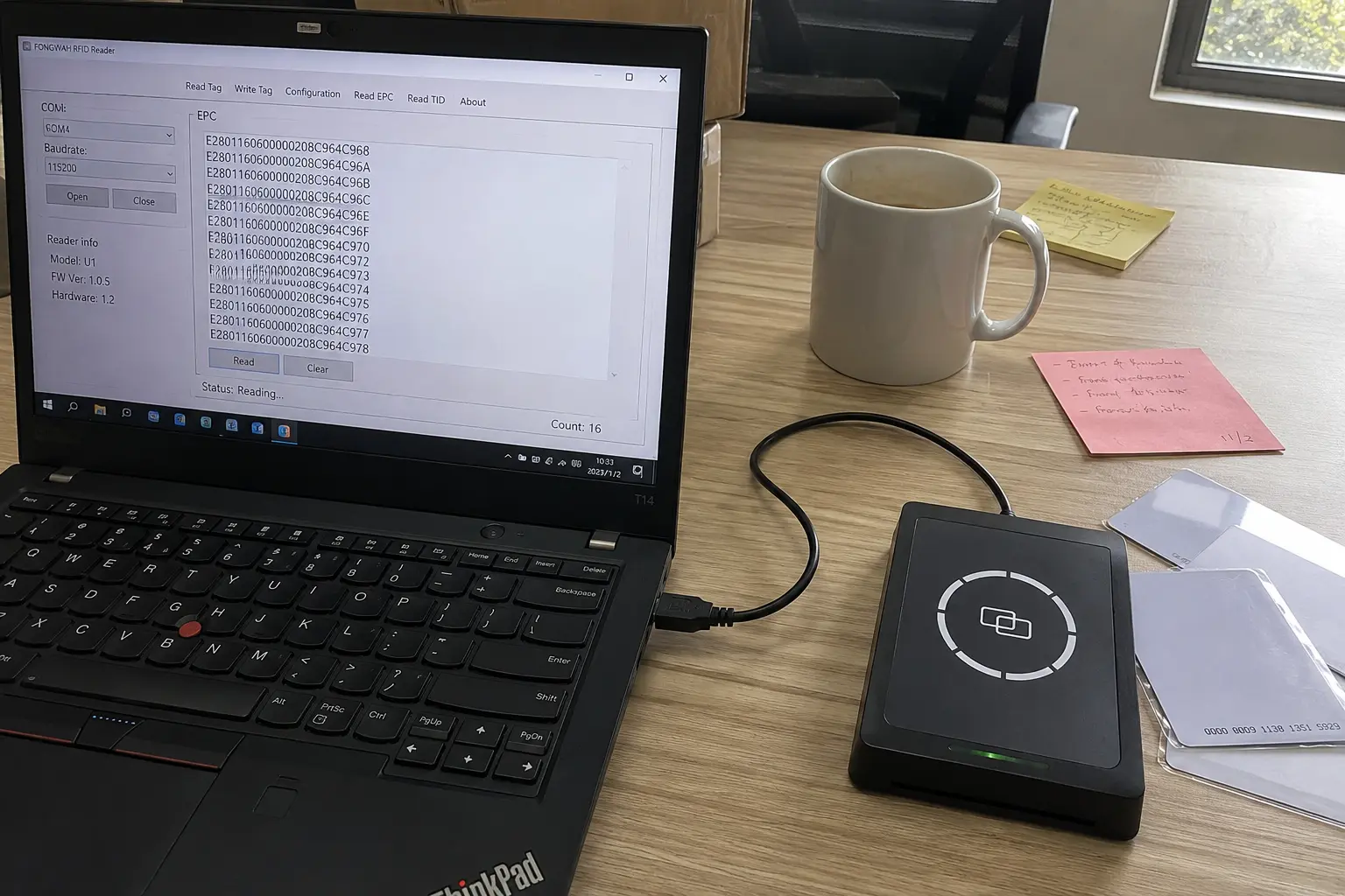 Fongwah desktop RFID reader connected to a laptop via a single USB cable for plug-and-play setup.