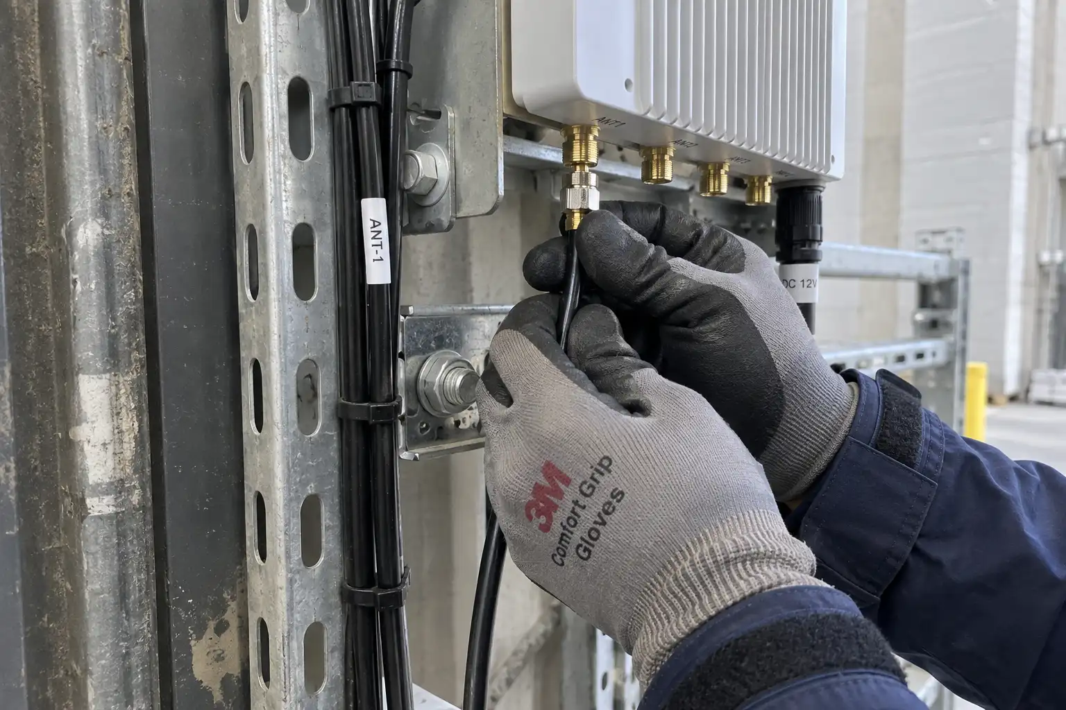 Close-up of an RFID reader's power and antenna cable connections
