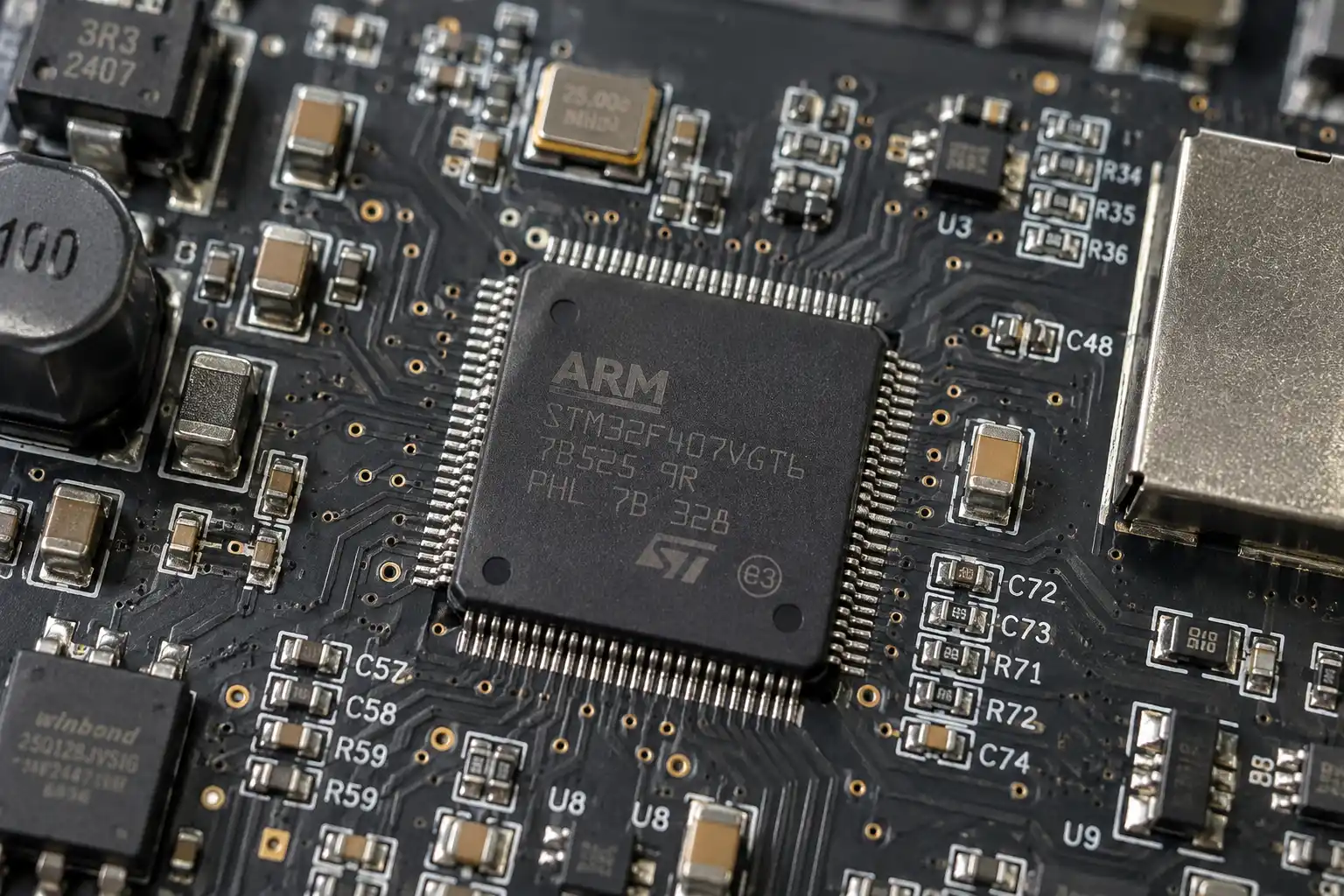A close-up of a microcontroller unit (MCU) on a circuit board