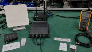 Comprehensive modern Fongwah RFID and IoT technology setup featuring UHF fixed readers, cloud gateway, antennas, and rugged on-metal tags on a test bench.