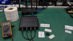 Comprehensive futuristic Fongwah RFID setup showing eco-friendly paper tags, smart sensor inlays, and AI edge IoT reader gateway on an engineering test bench.