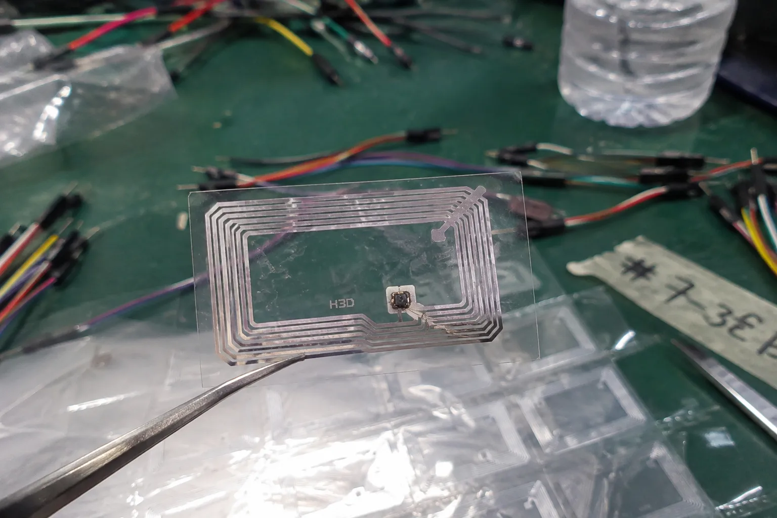 An RFID inlay showing the chip and antenna connection