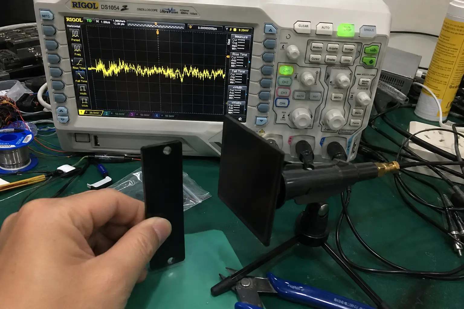 An RFID tag attached to a water bottle with signal waves being absorbed