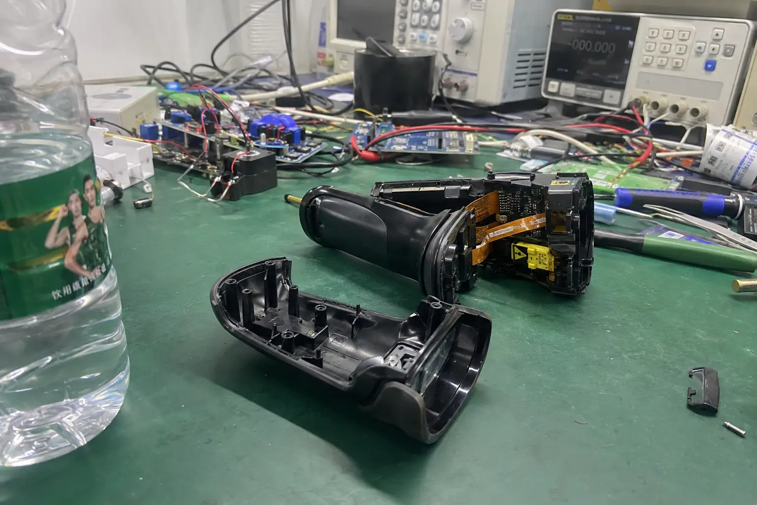 Fongwah embedded RFID reader module integrated inside a disassembled industrial handheld scanner tool on a laboratory workbench