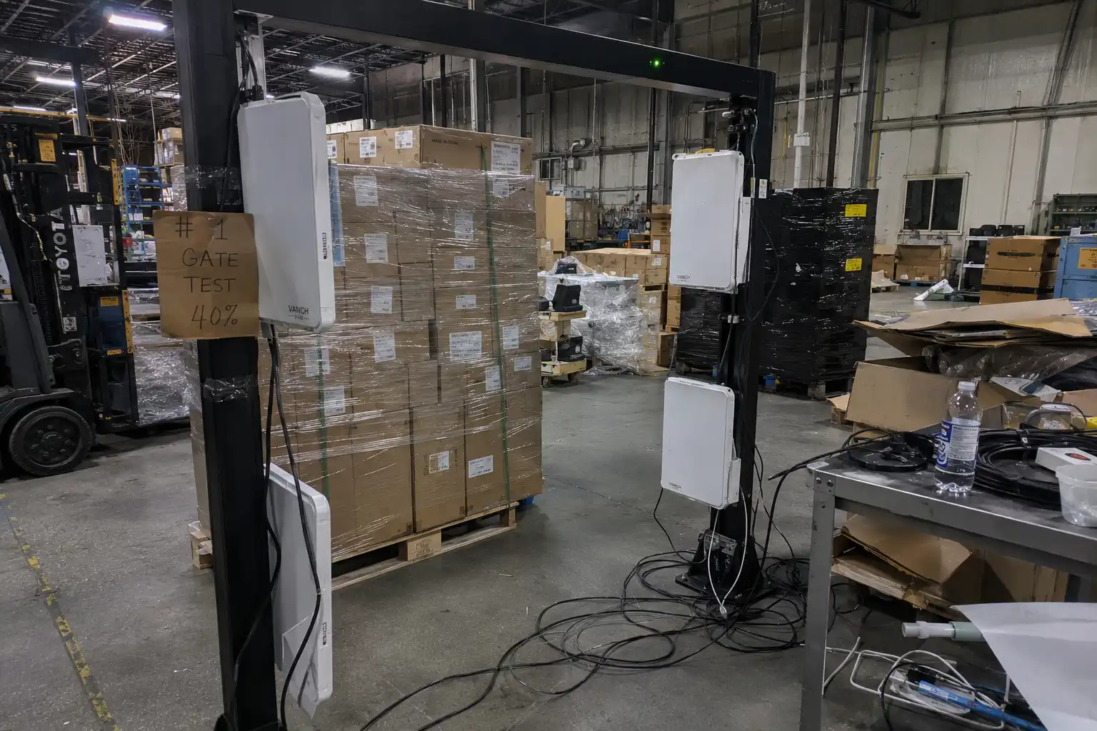 A warehouse RFID portal showing red 'X' marks on many boxes on a pallet, visualizing missed reads and range loss.