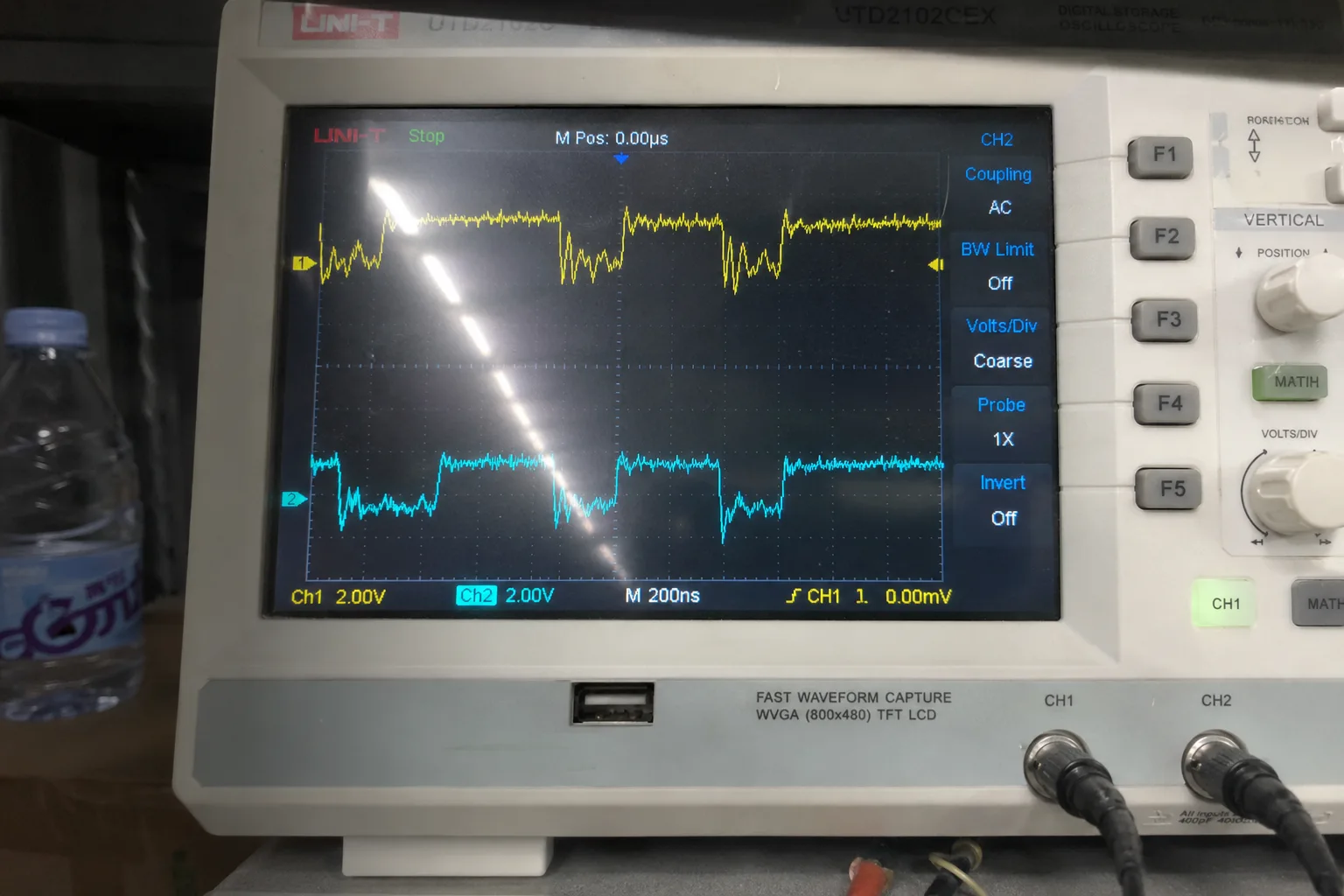 Oscilloscope showing a noisy UART signal with voltage ripples